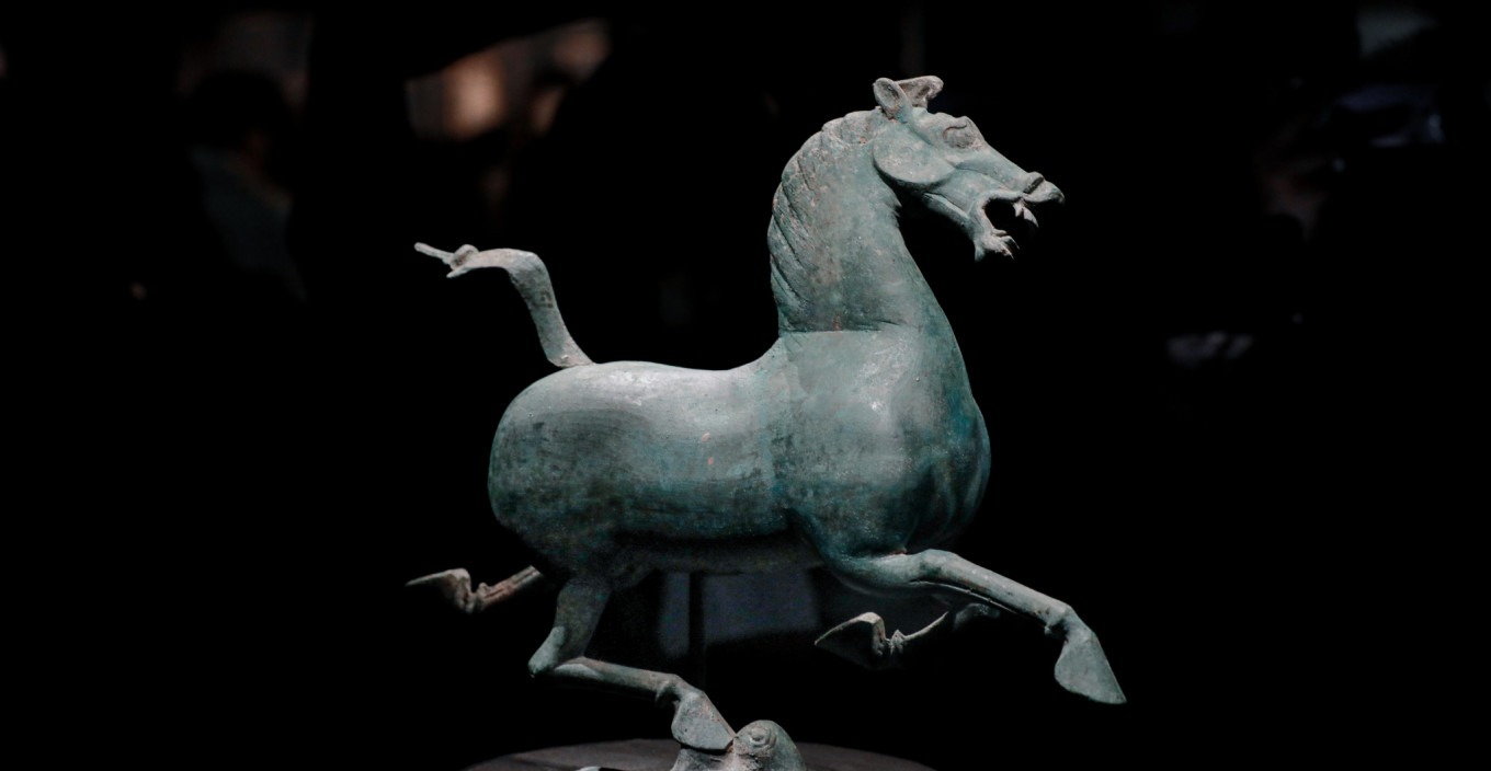Bronze galloping horse side view