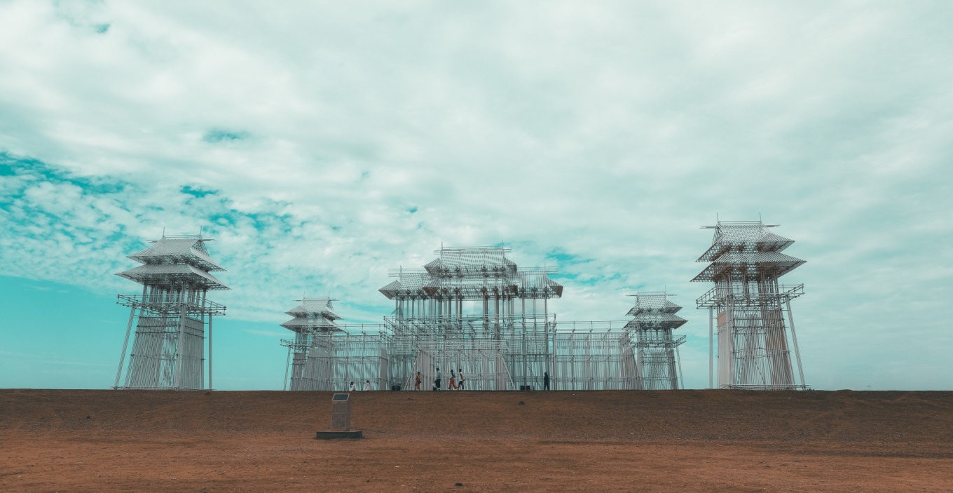 Wujie stainless steel sculpture against desert sky