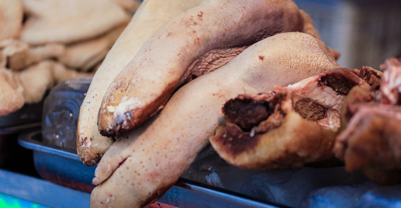 Beef tendon skewers being grilled