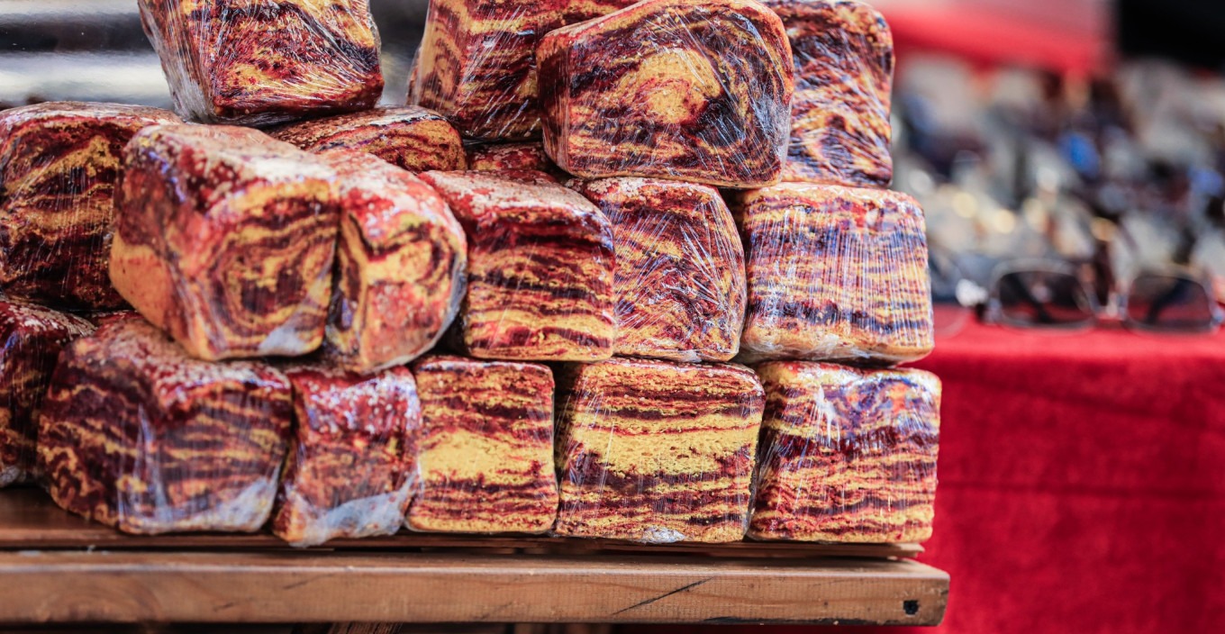 Naan bread stacked at a stall