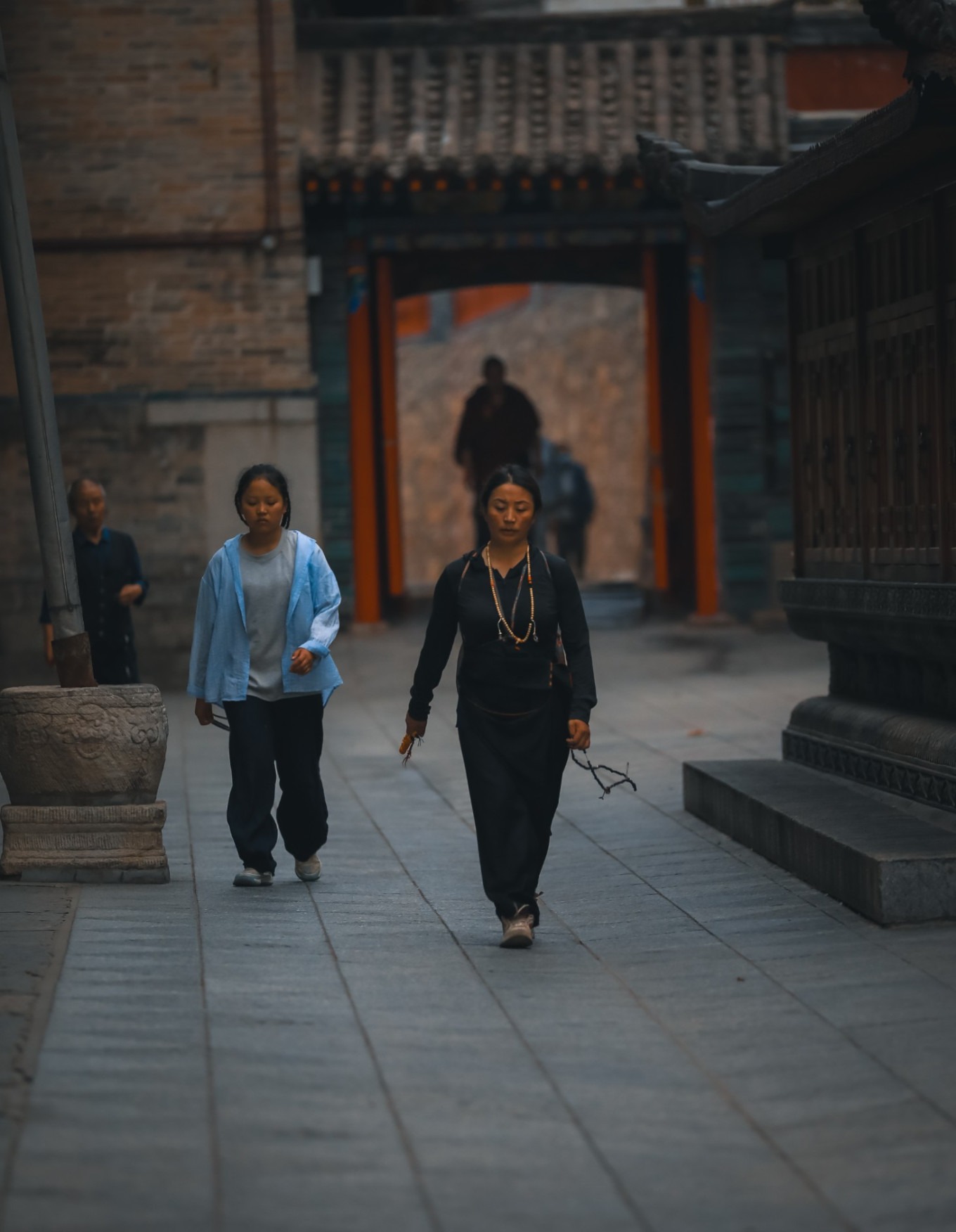 Grandmother and child walking together around the hall