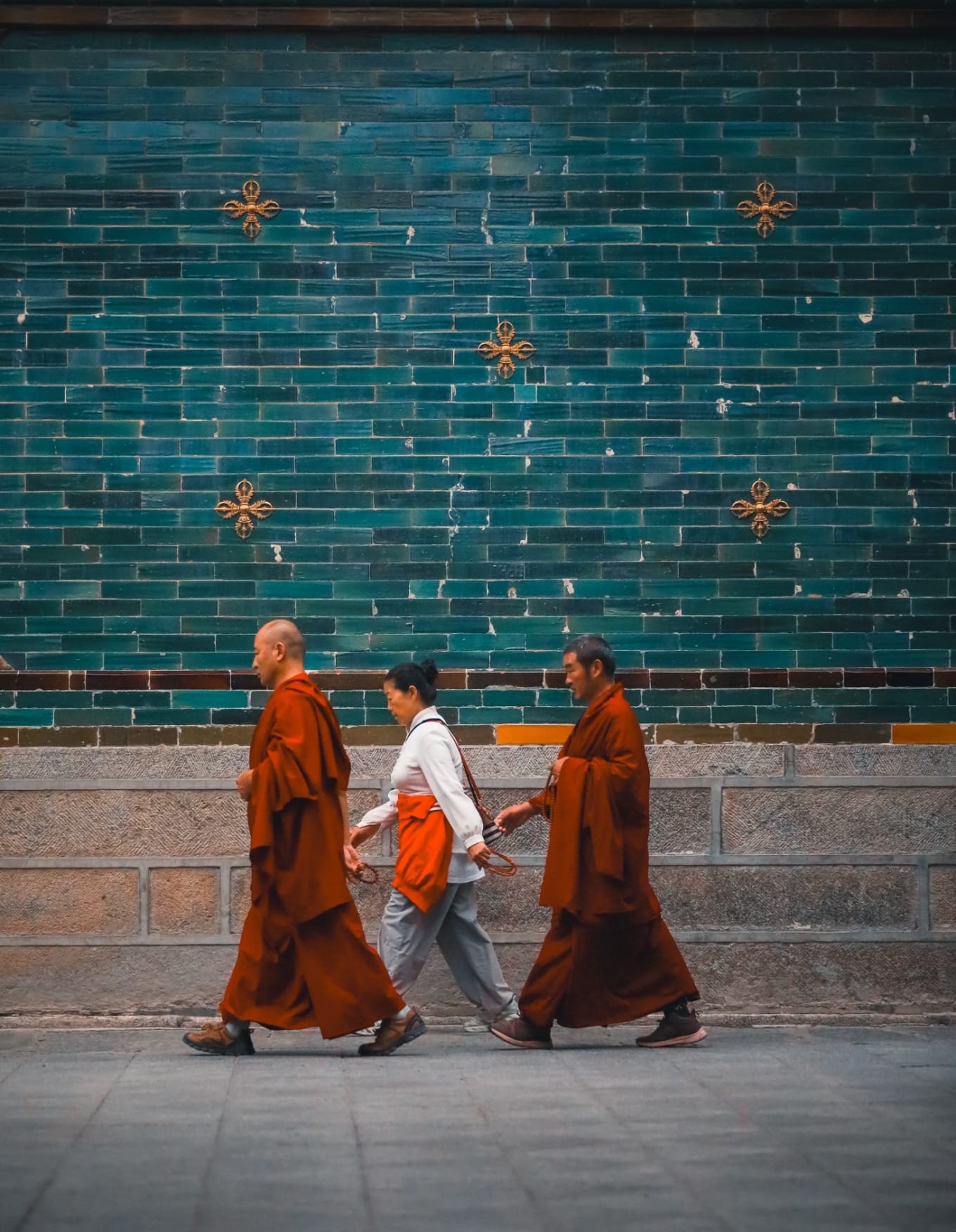 Pilgrims circumambulating the hall with prayer beads