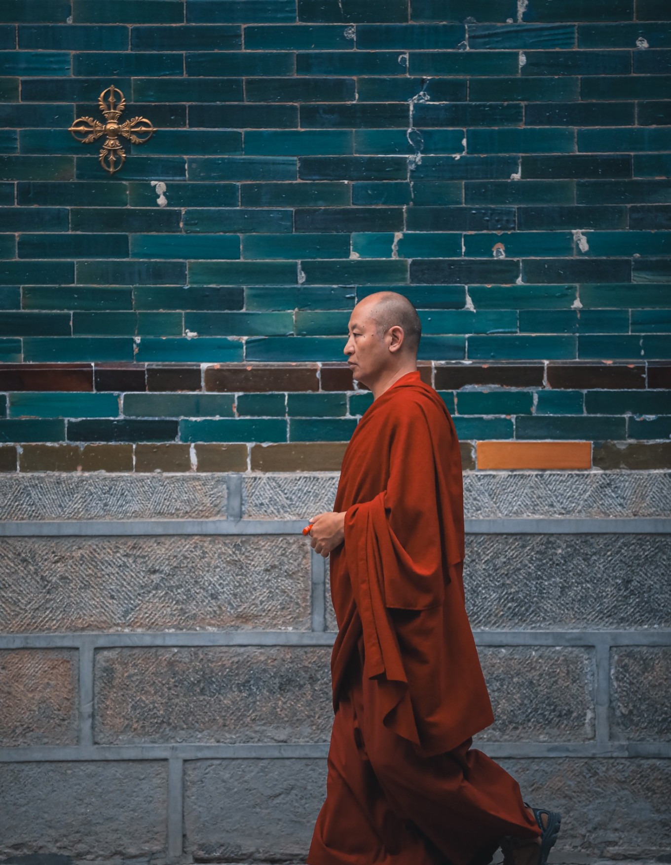 Monk in red robes circumambulating