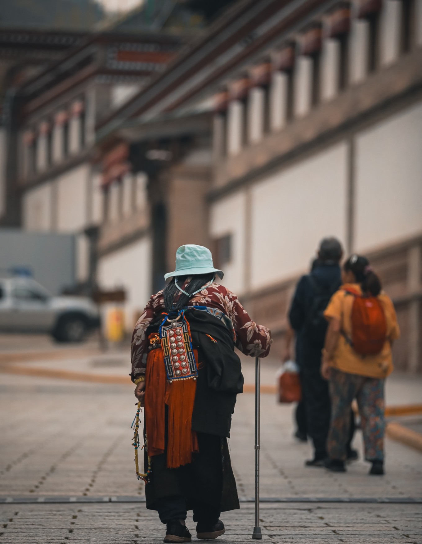 Side view of elderly pilgrim walking slowly