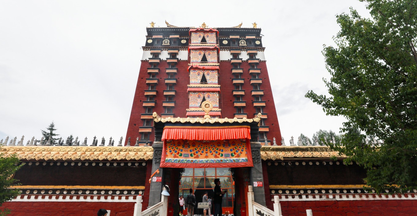 Devotees making offerings at a shrine inside the monastery